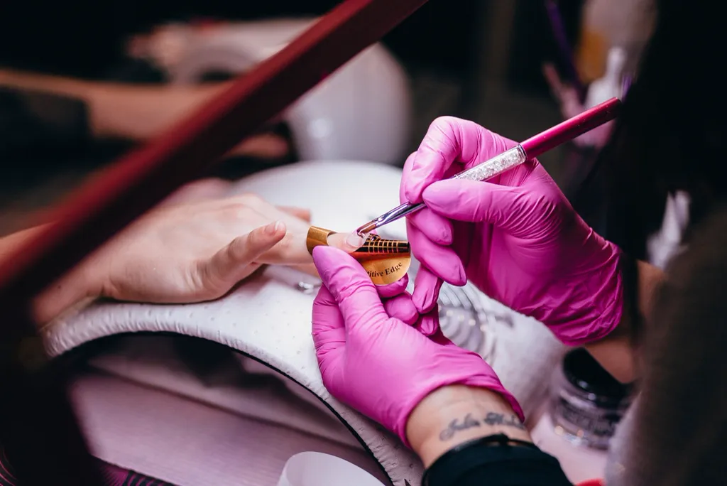 Manicure in progress at a nail station